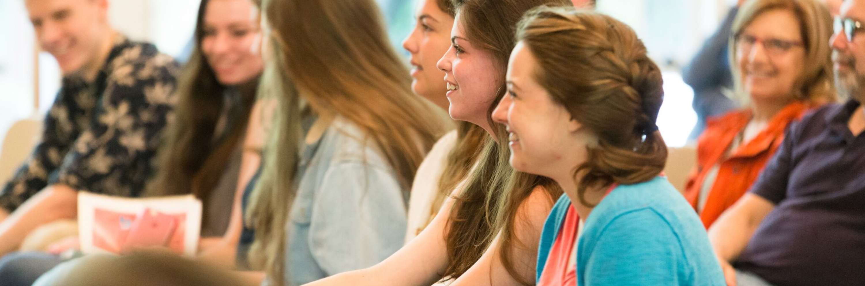 young adults during worship laughing